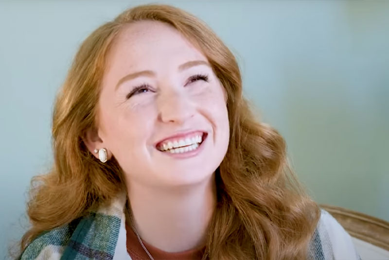 Headshot of dental patient smiling brightly after their procedure