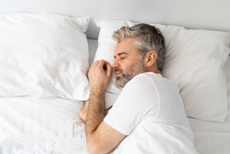 mature male sleeping restfully