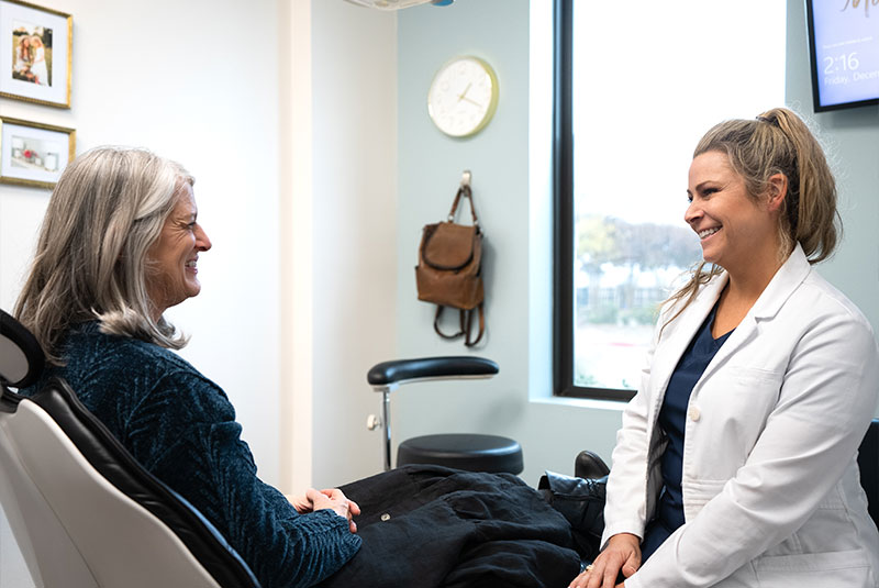 Dr. Schuster Kathleen consulting with patient