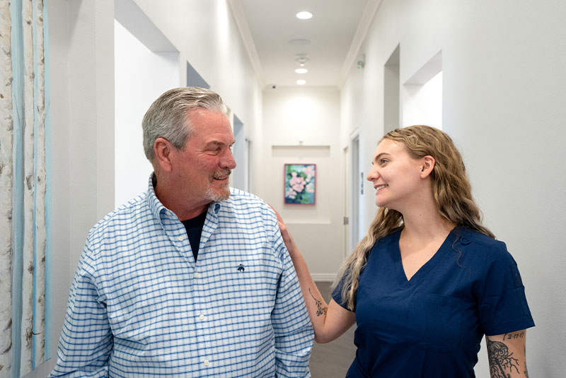 team member consulting with patient about myofunctional